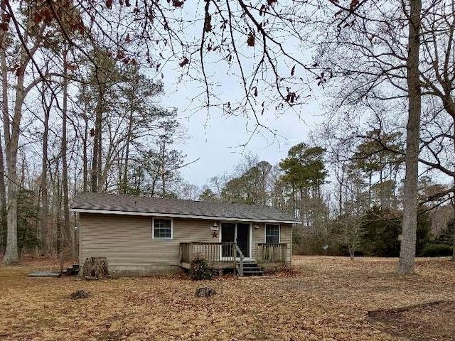 view of front of property featuring a wooden deck