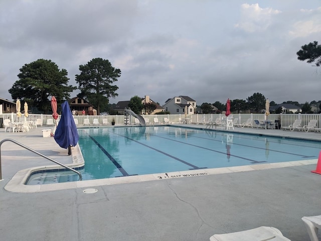 view of pool featuring a patio