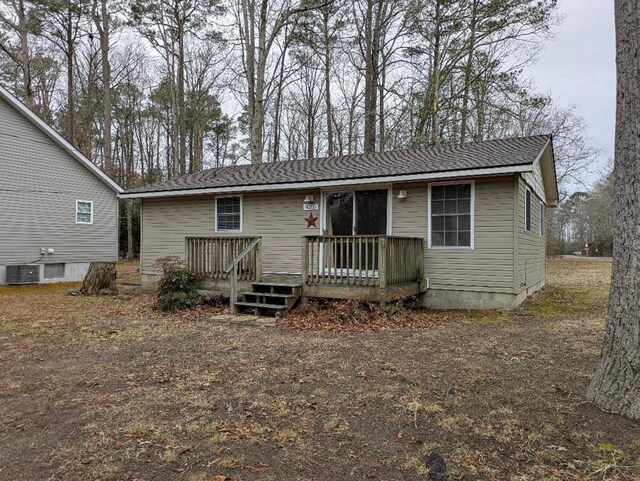 back of house featuring a wooden deck