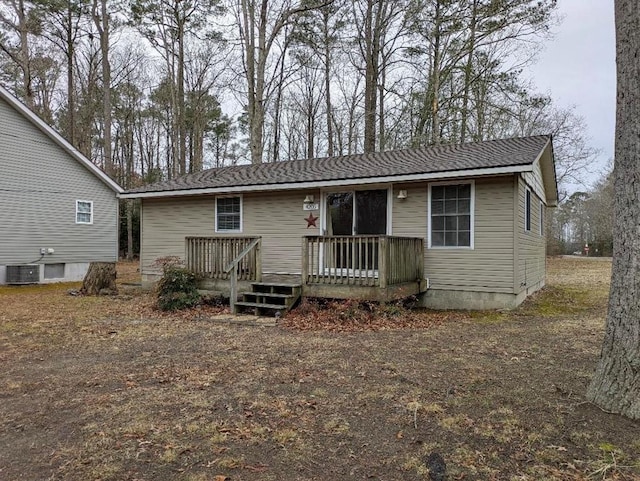 view of front of house with central AC and a deck