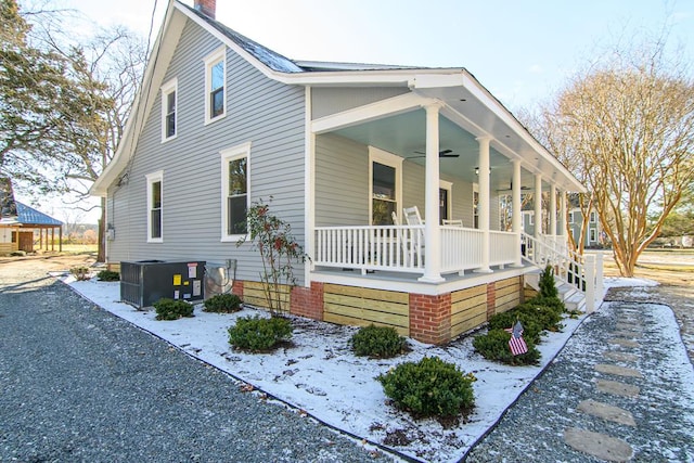 exterior space with central air condition unit, ceiling fan, and a porch