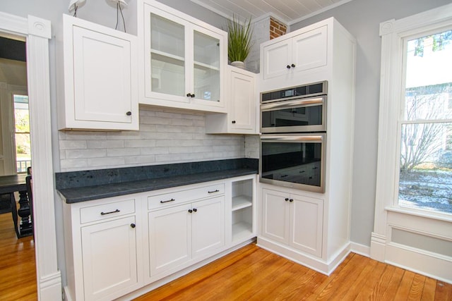 kitchen featuring white cabinets and stainless steel double oven