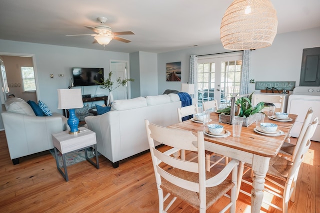 6345 Clark St, Chincoteague, VA 23336 - dining room with electric panel, ceiling fan, french doors, light wood finished floors, and healthy amount of natural light