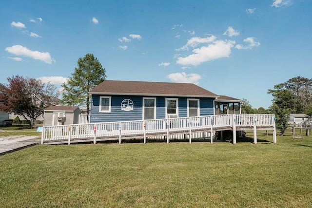 6345 Clark St, Chincoteague, VA 23336 - rear view of property featuring a deck, a lawn, and roof with shingles