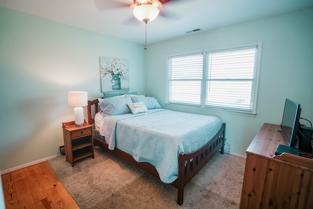 6345 Clark St, Chincoteague, VA 23336 - bedroom with wood finished floors and ceiling fan