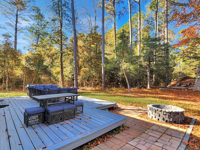 wooden deck with a fire pit