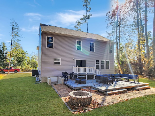 rear view of house with a lawn, central air condition unit, a deck, and an outdoor living space with a fire pit