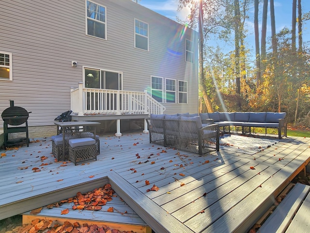 wooden terrace featuring outdoor lounge area