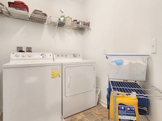 clothes washing area with washer and dryer