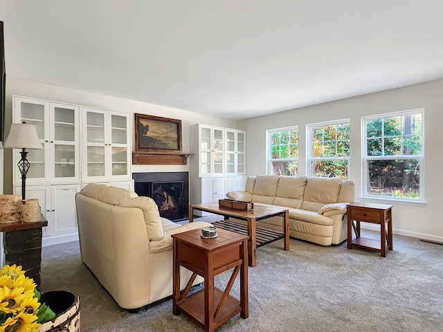 living room with dark colored carpet