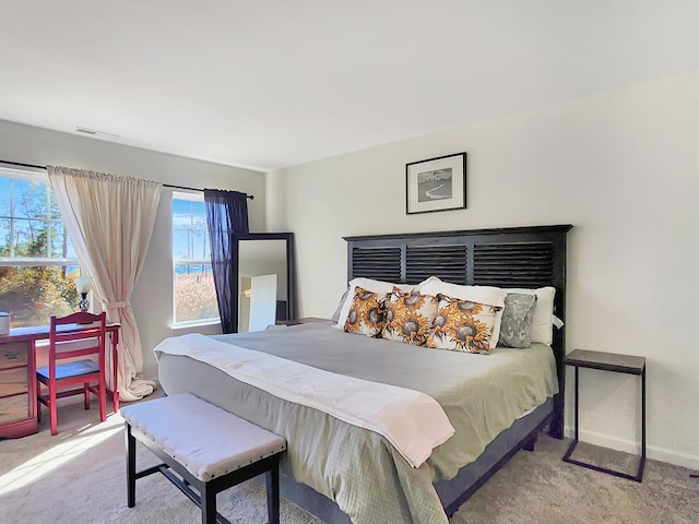 bedroom featuring light colored carpet