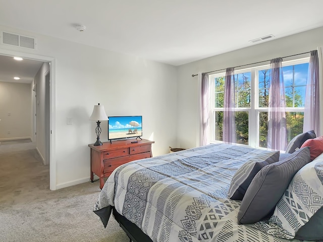 bedroom featuring light carpet