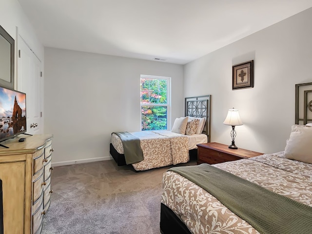 bedroom with light carpet