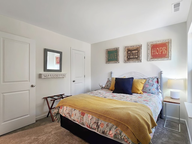 bedroom with dark carpet