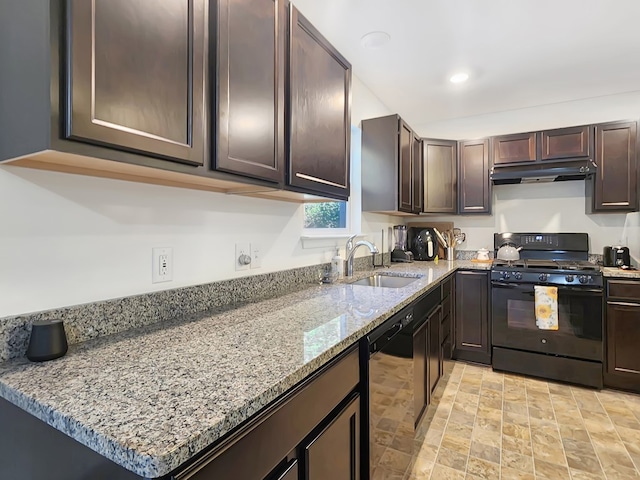 kitchen featuring black appliances, dark brown cabinets, light stone counters, and sink