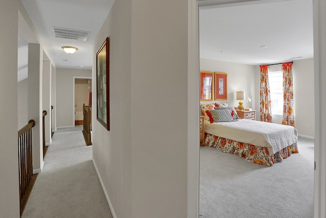 bedroom featuring light colored carpet