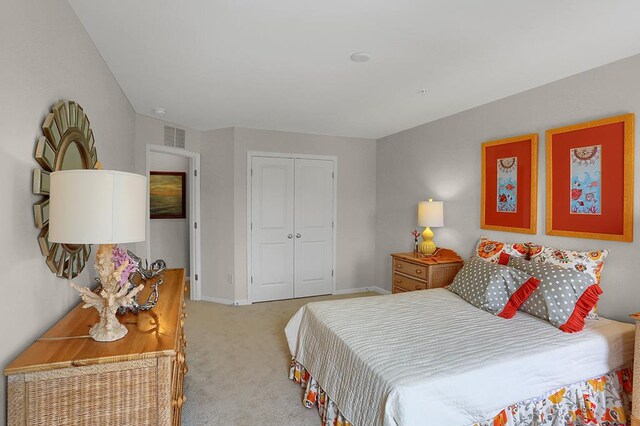 carpeted bedroom with a closet