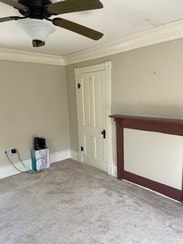12 Justis St, Onancock, VA 23417 - carpeted empty room featuring ornamental molding, ceiling fan, and baseboards