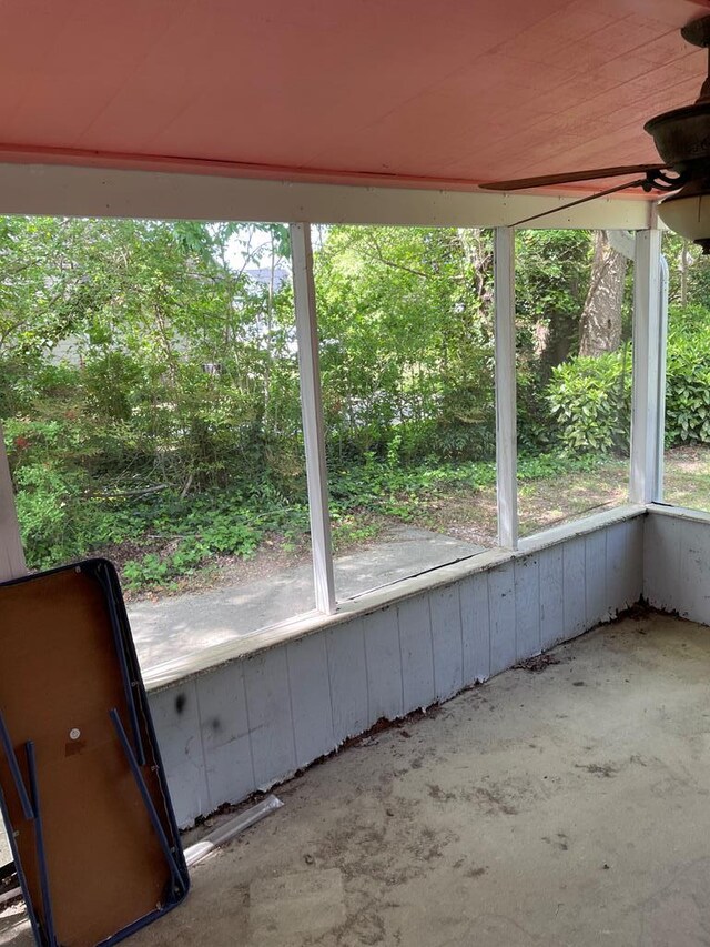 12 Justis St, Onancock, VA 23417 - unfurnished sunroom with a ceiling fan