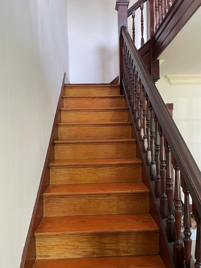12 Justis St, Onancock, VA 23417 - stairway featuring a towering ceiling