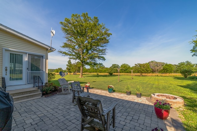 view of patio with a grill and an outdoor fire pit