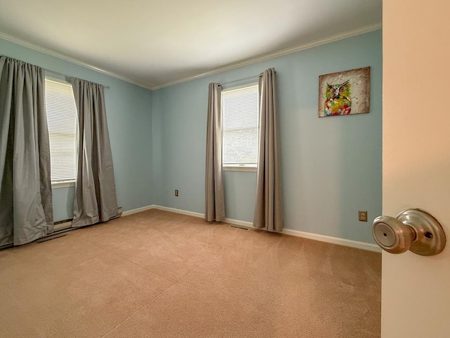 empty room featuring ornamental molding, light carpet, baseboards, and visible vents