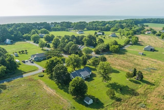 birds eye view of property with a water view and a rural view