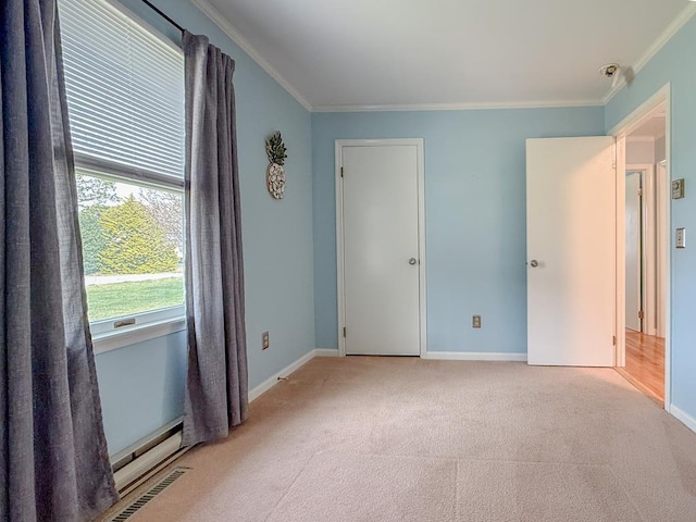 unfurnished bedroom featuring baseboards, ornamental molding, visible vents, and light colored carpet