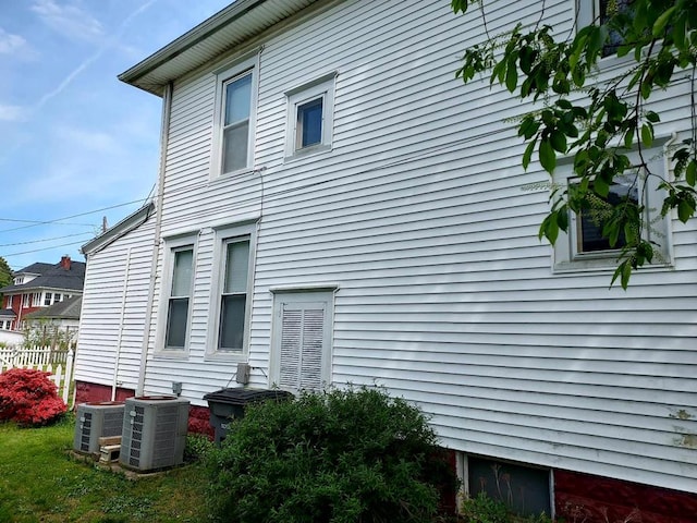 view of side of property with central AC unit