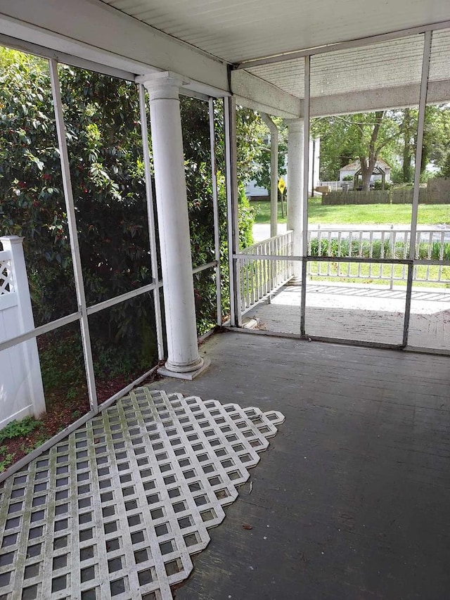 unfurnished sunroom with a healthy amount of sunlight