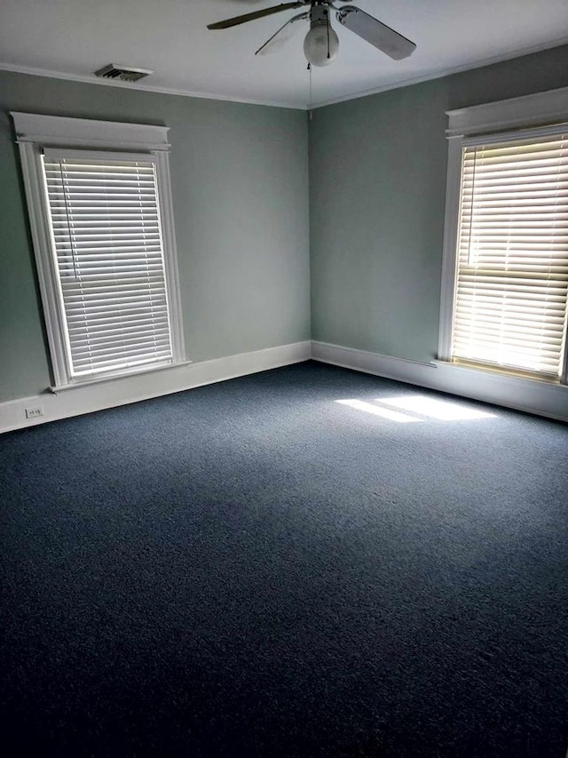 spare room featuring carpet and ceiling fan