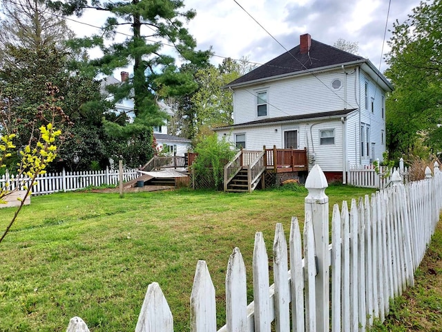 exterior space featuring a yard and a wooden deck