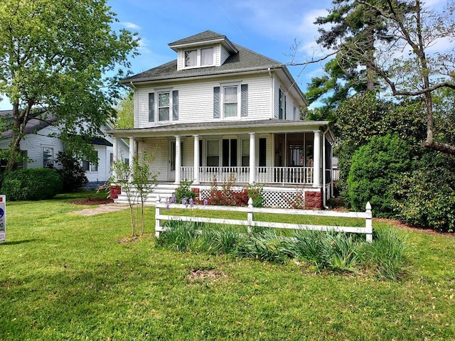 view of front facade featuring a porch and a front yard