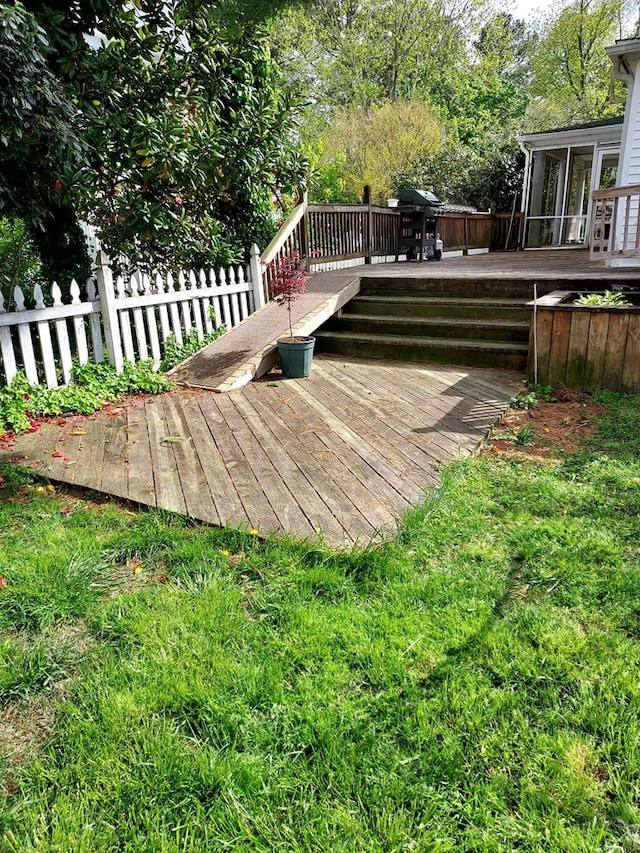 wooden deck featuring a sunroom