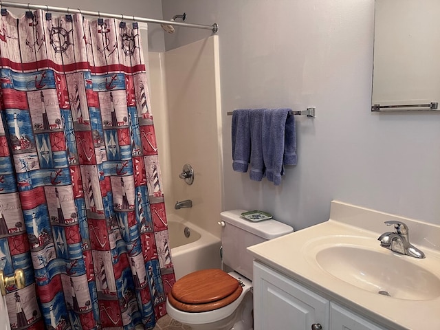 bathroom featuring toilet, shower / tub combo with curtain, and vanity