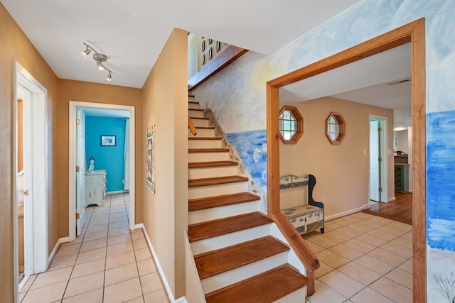 stairway featuring tile patterned floors