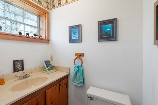 bathroom with vanity and toilet