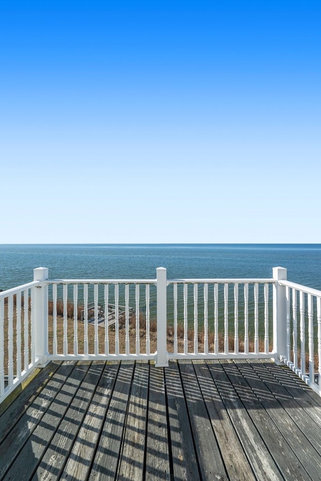 wooden deck featuring a water view