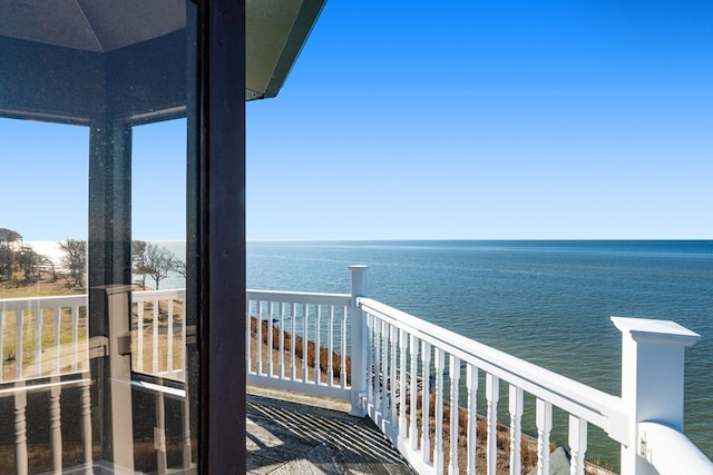 balcony featuring a water view