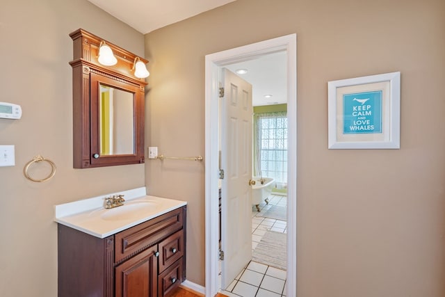 bathroom with tile patterned flooring and vanity