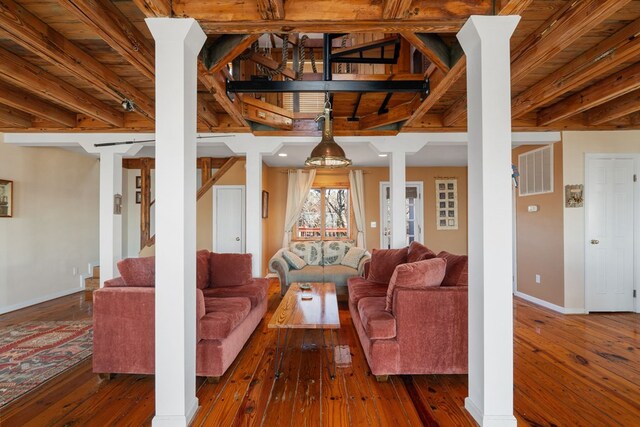 living room with beam ceiling, wooden ceiling, and dark hardwood / wood-style floors