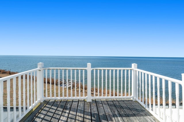 wooden terrace with a water view