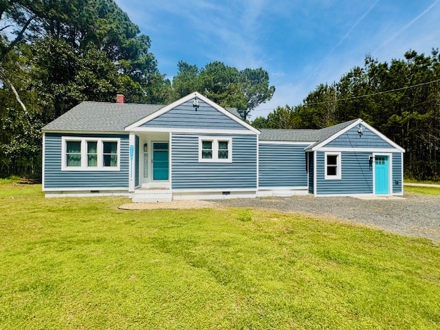 view of front of house with driveway, crawl space, a front yard, and roof with shingles