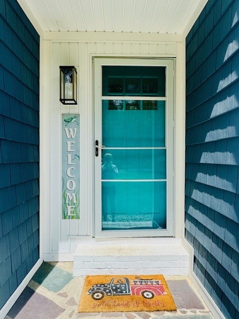 doorway to property featuring a porch
