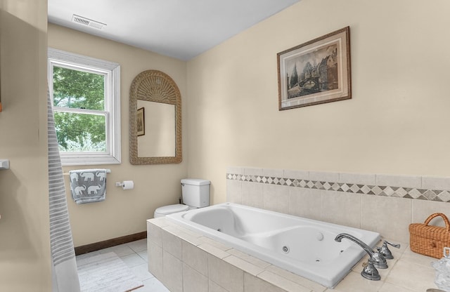 28099 Harborton Rd, Harborton, VA 23389 - bathroom featuring a whirlpool tub, toilet, tile patterned floors, and baseboards