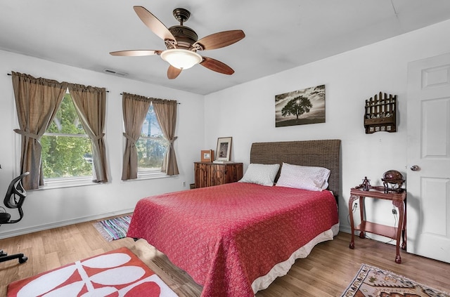 28099 Harborton Rd, Harborton, VA 23389 - bedroom with light wood finished floors, baseboards, and a ceiling fan