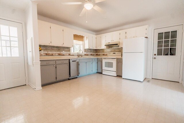 kitchen featuring white cabinets, gray cabinets, white appliances, and sink