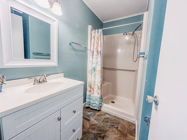 bathroom featuring a shower with curtain and vanity