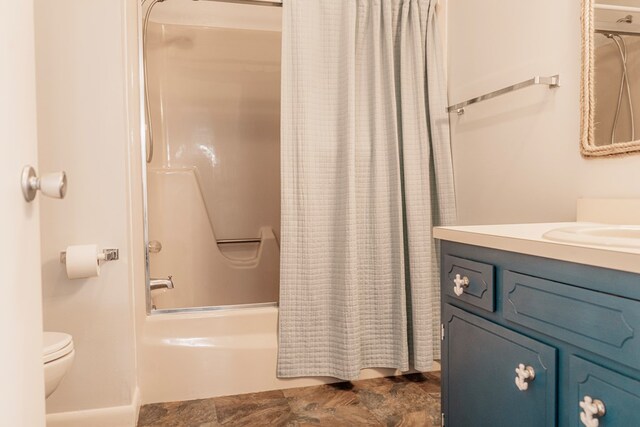 full bathroom featuring shower / tub combo, vanity, and toilet