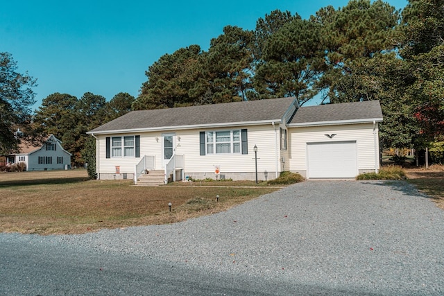 ranch-style home with a garage and a front lawn